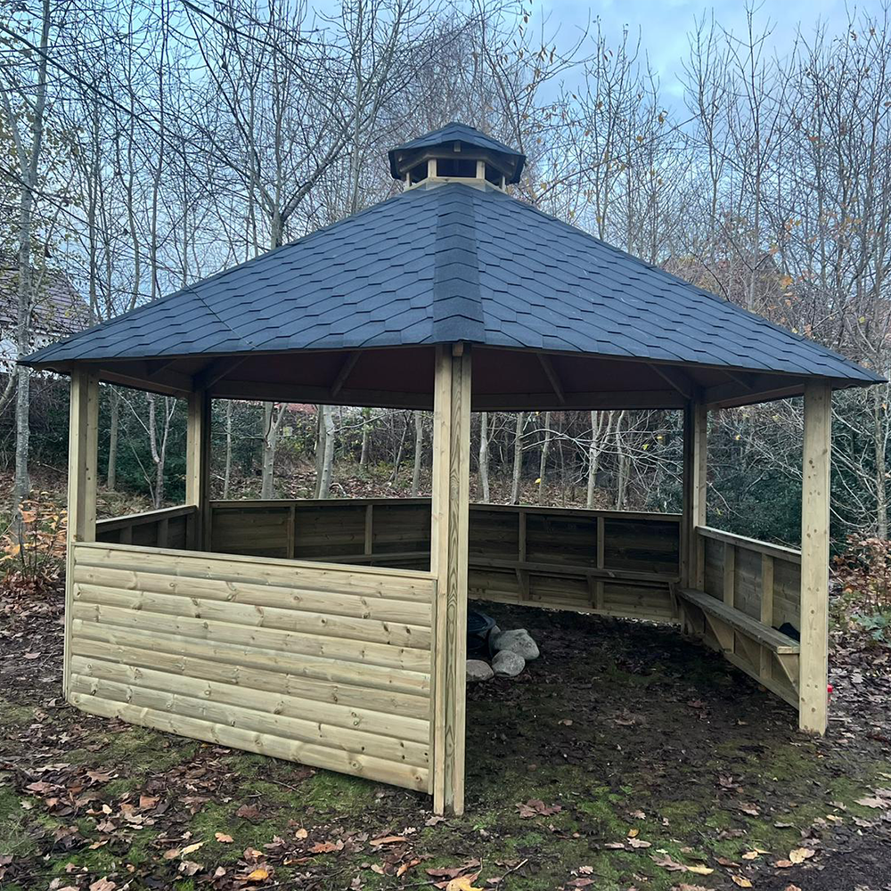 Forest Firepit Shelter (with half enclosed sides and seating)