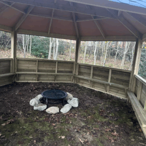Forest Firepit Shelter (with half enclosed sides and seating)